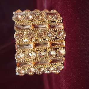 Rose gold colored costume jewelry bracelet